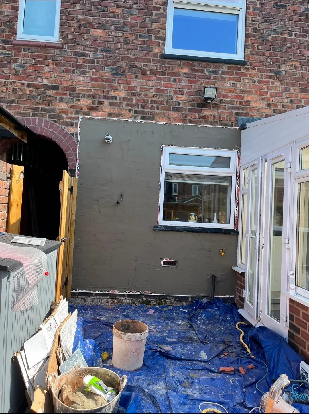 Preparation and rendering underway on the rear elevation