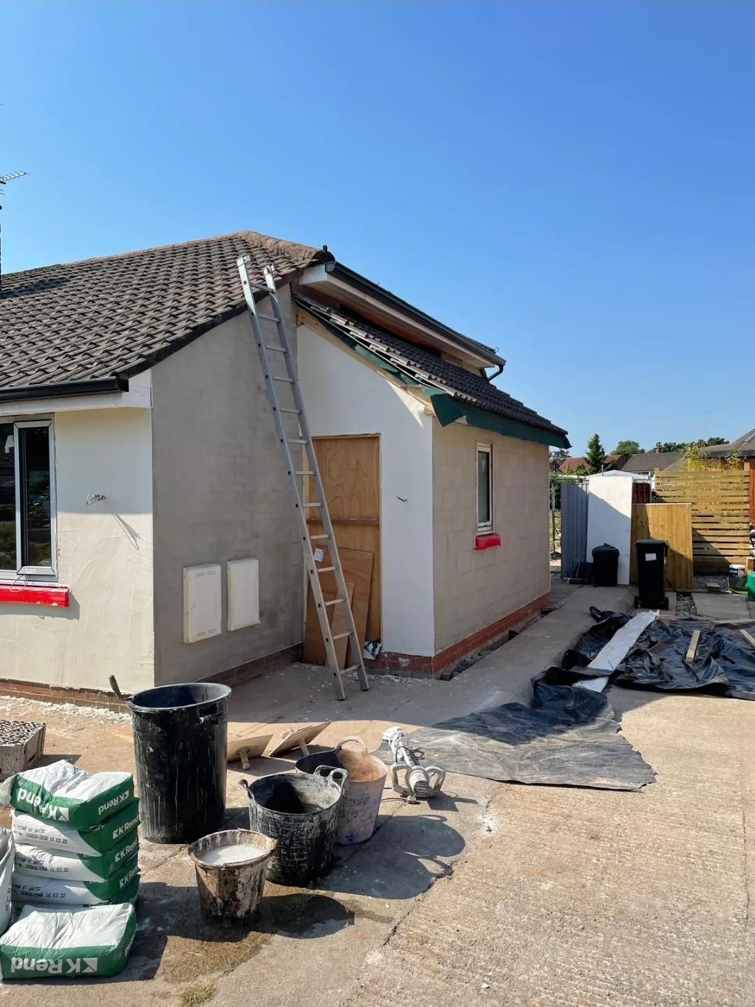 Rendered single-storey extension nearing completion