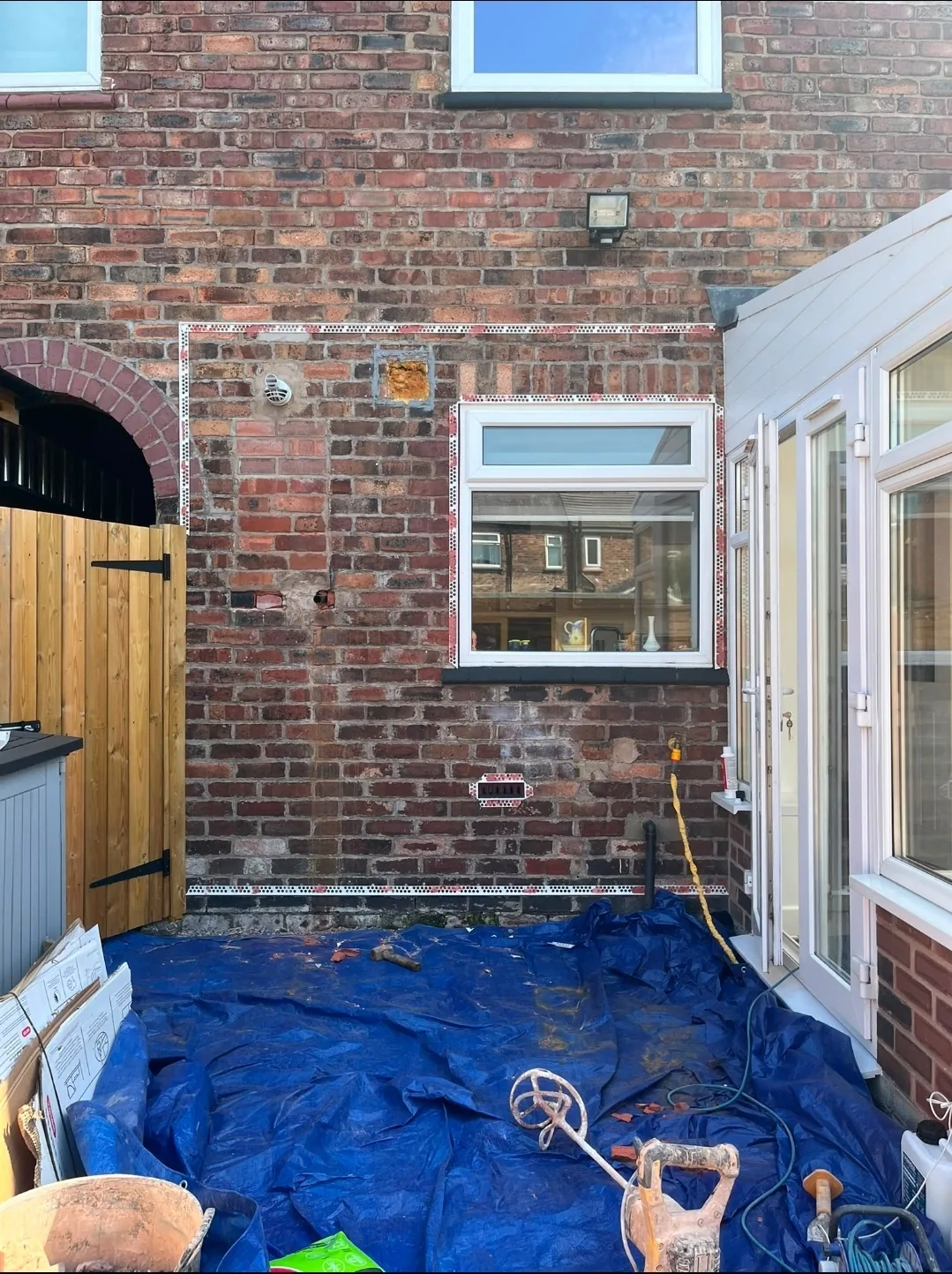 Exposed brickwork on a rear elevation before exterior rendering by Tameside Plastering