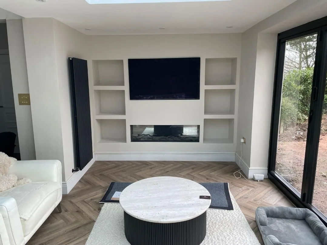 Finished media wall and plastered living room